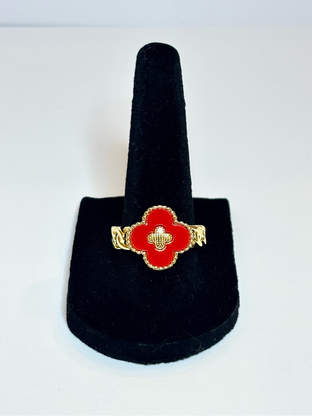 Gold clover ring with red enamel